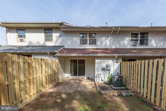a front view of a house with parking area