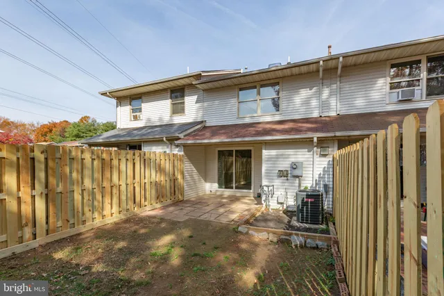 a view of a house with wooden walls