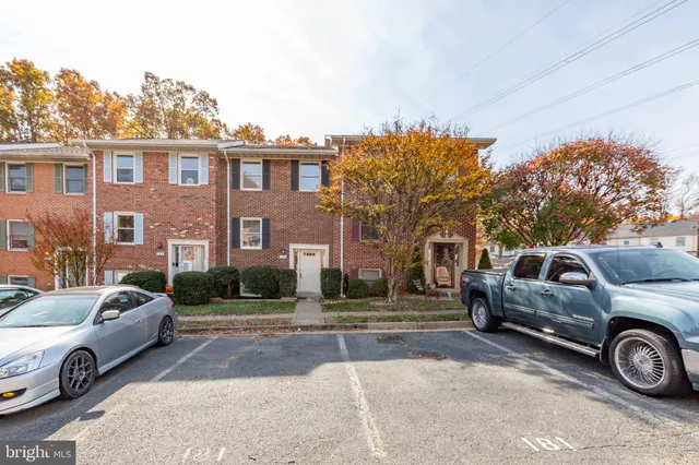 a view of a car parked in front of a house