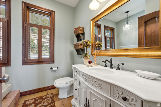 335 Bern Way Midway, UT 84049 - Photo 71 of 88 Bathroom vanity featuring an integrated sink, white countertop, and ornate cabinetry