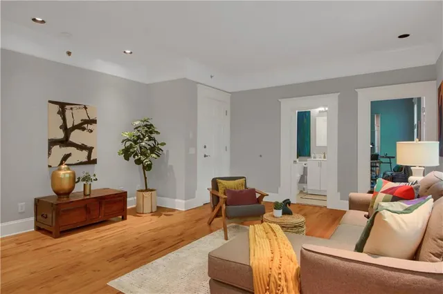 a living room with furniture and flowers