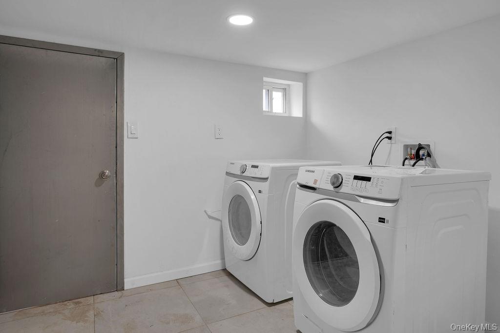 173-62 103rd Road Queens, NY 11433 - Photo 19 of 23 a utility room with dryer and washer