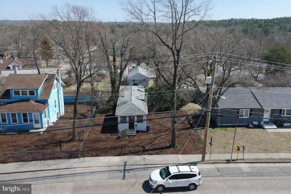 a front view of a houses with yard