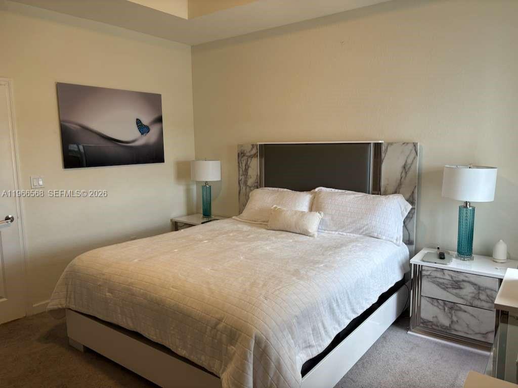 3350 Northwest 112th Street Hialeah, FL 33018 - Photo 13 of 40 a bedroom with a bed and painting on the wall