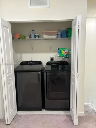 a utility room with washer and dryer