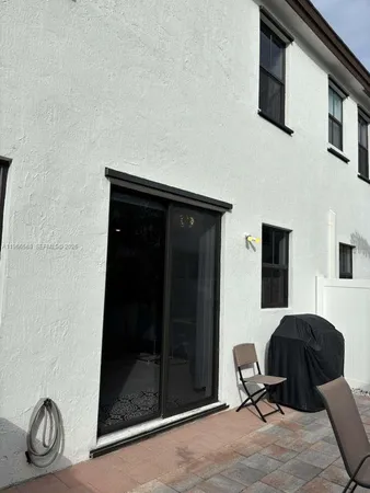 a bedroom with a bed and a chair