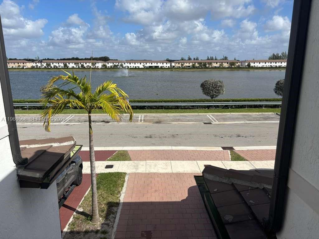 3350 Northwest 112th Street Hialeah, FL 33018 - Photo 23 of 40 a terrace with a table and chairs