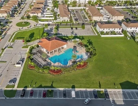 an aerial view of a houses with outdoor space