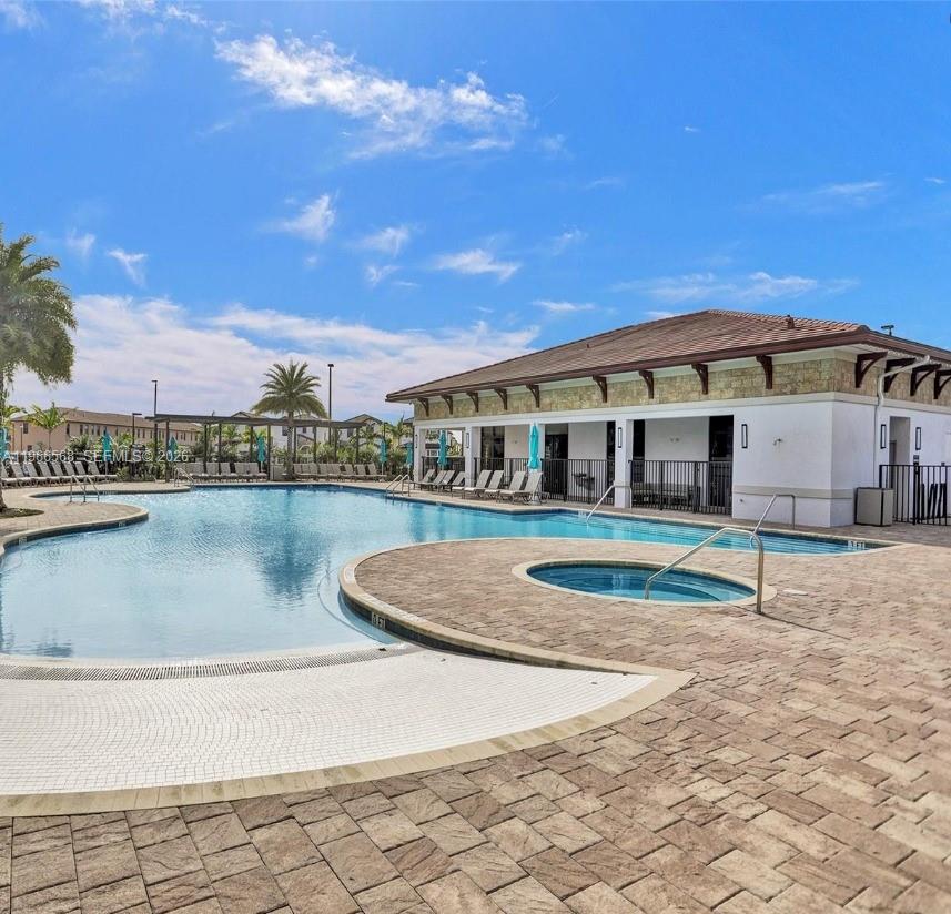 3350 Northwest 112th Street Hialeah, FL 33018 - Photo 26 of 40 a front view of a house with a yard
