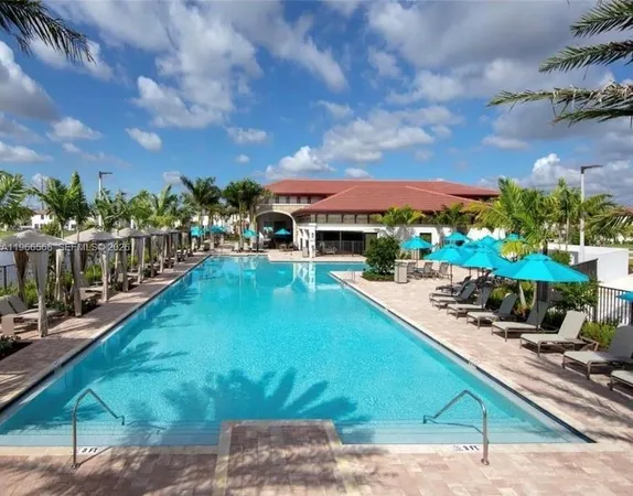 a view of a swimming pool with a patio
