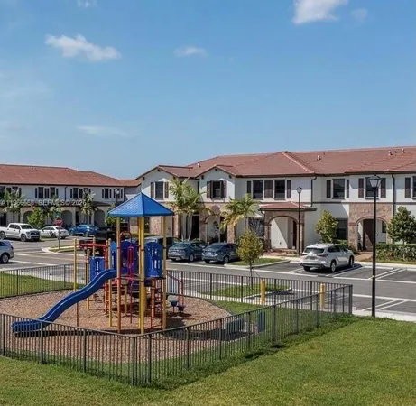 a view of multiple houses with a yard