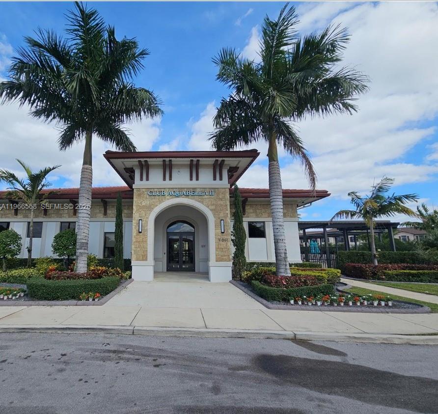 3350 Northwest 112th Street Hialeah, FL 33018 - Photo 35 of 40 a front view of a house with a garden