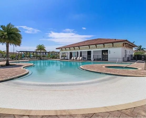 a view of a house with a yard and sitting area