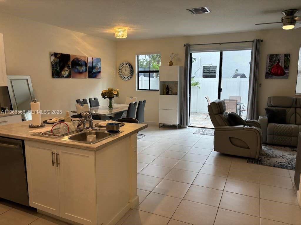 3350 Northwest 112th Street Hialeah, FL 33018 - Photo 7 of 40 a kitchen with a sink and a stove top oven