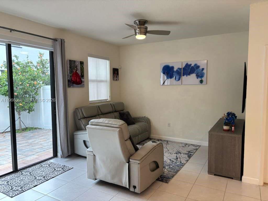 3350 Northwest 112th Street Hialeah, FL 33018 - Photo 9 of 40 a living room with furniture and a window