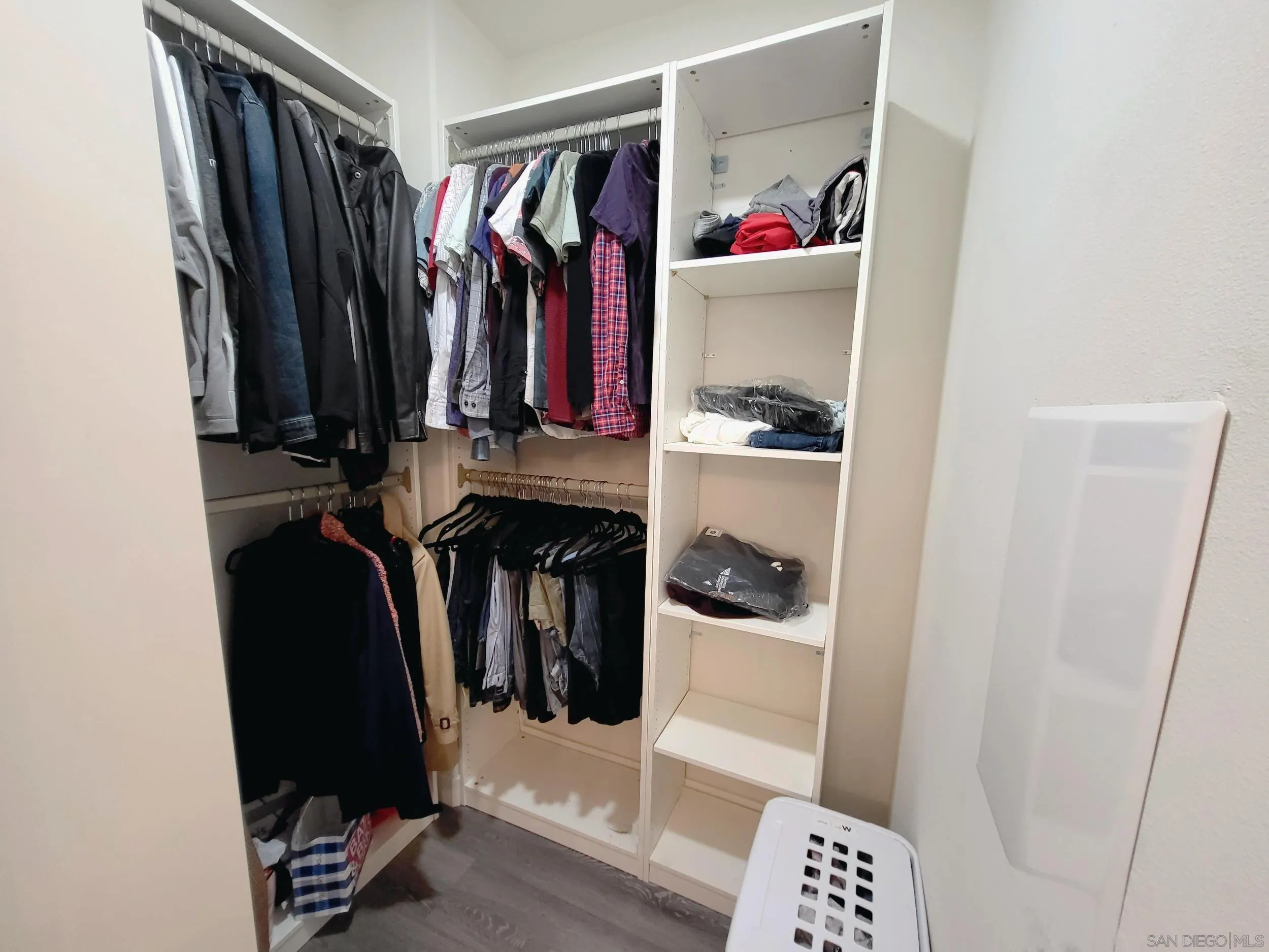 2152 Cosmo Way San Marcos, CA 92078 - Photo 11 of 28 a view of walk in closet with clothes and shoes