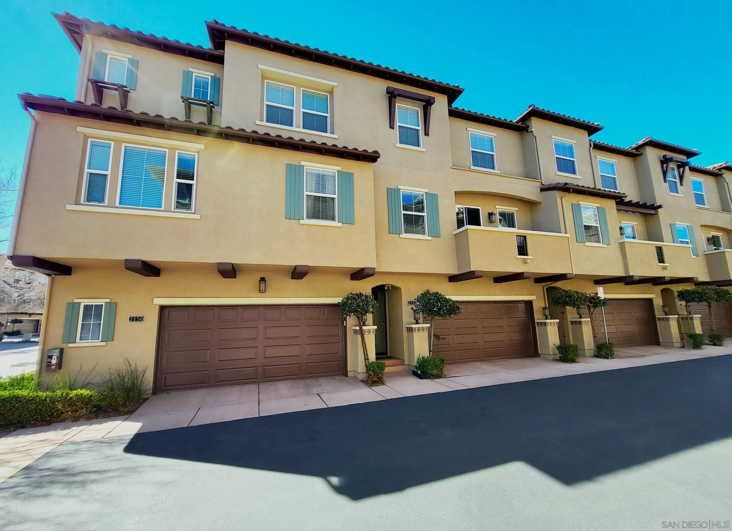 2152 Cosmo Way San Marcos, CA 92078 - Photo 19 of 28 a front view of a house with large windows