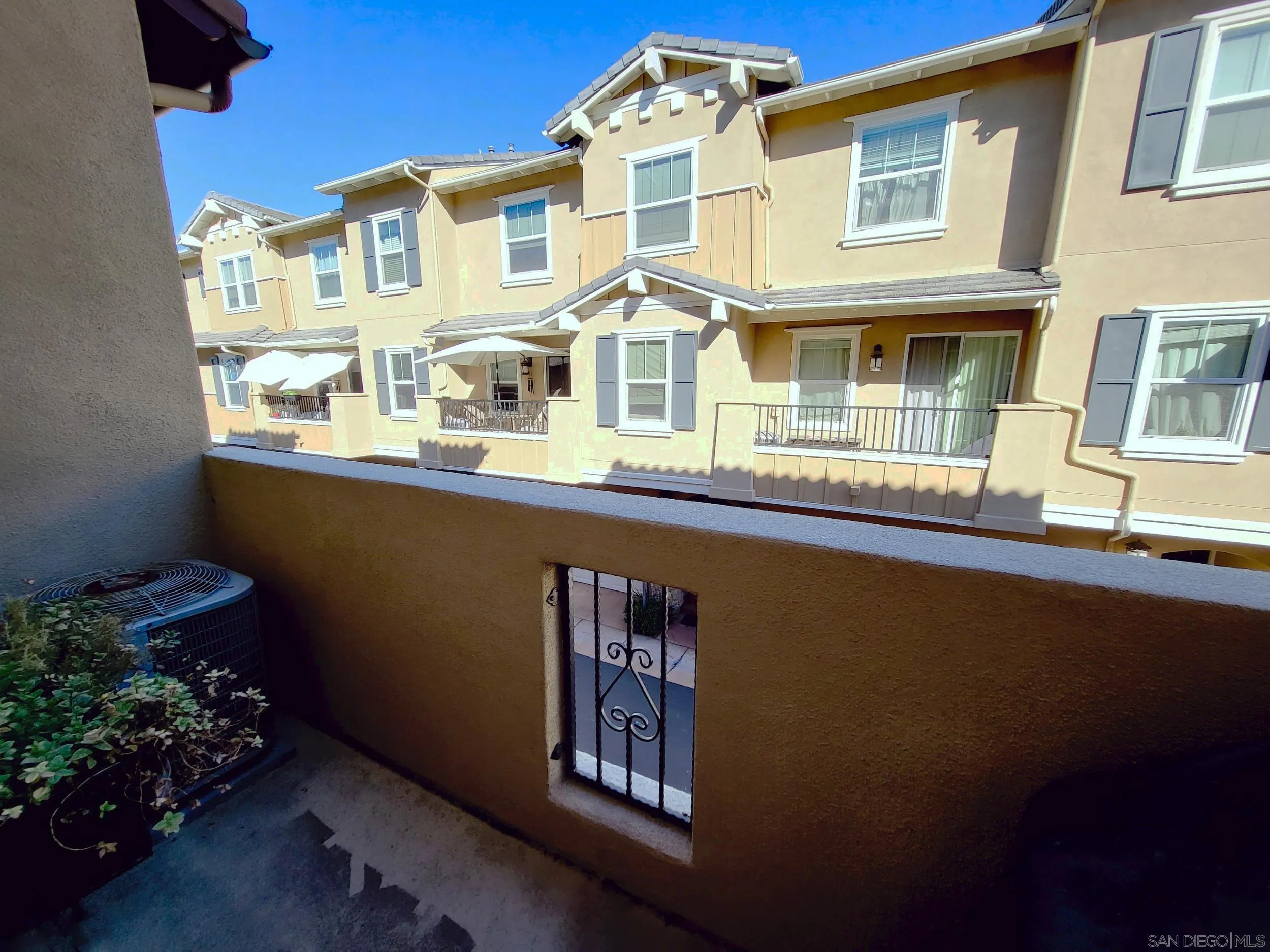 2152 Cosmo Way San Marcos, CA 92078 - Photo 20 of 28 a front view of a house with lots of green space and plants
