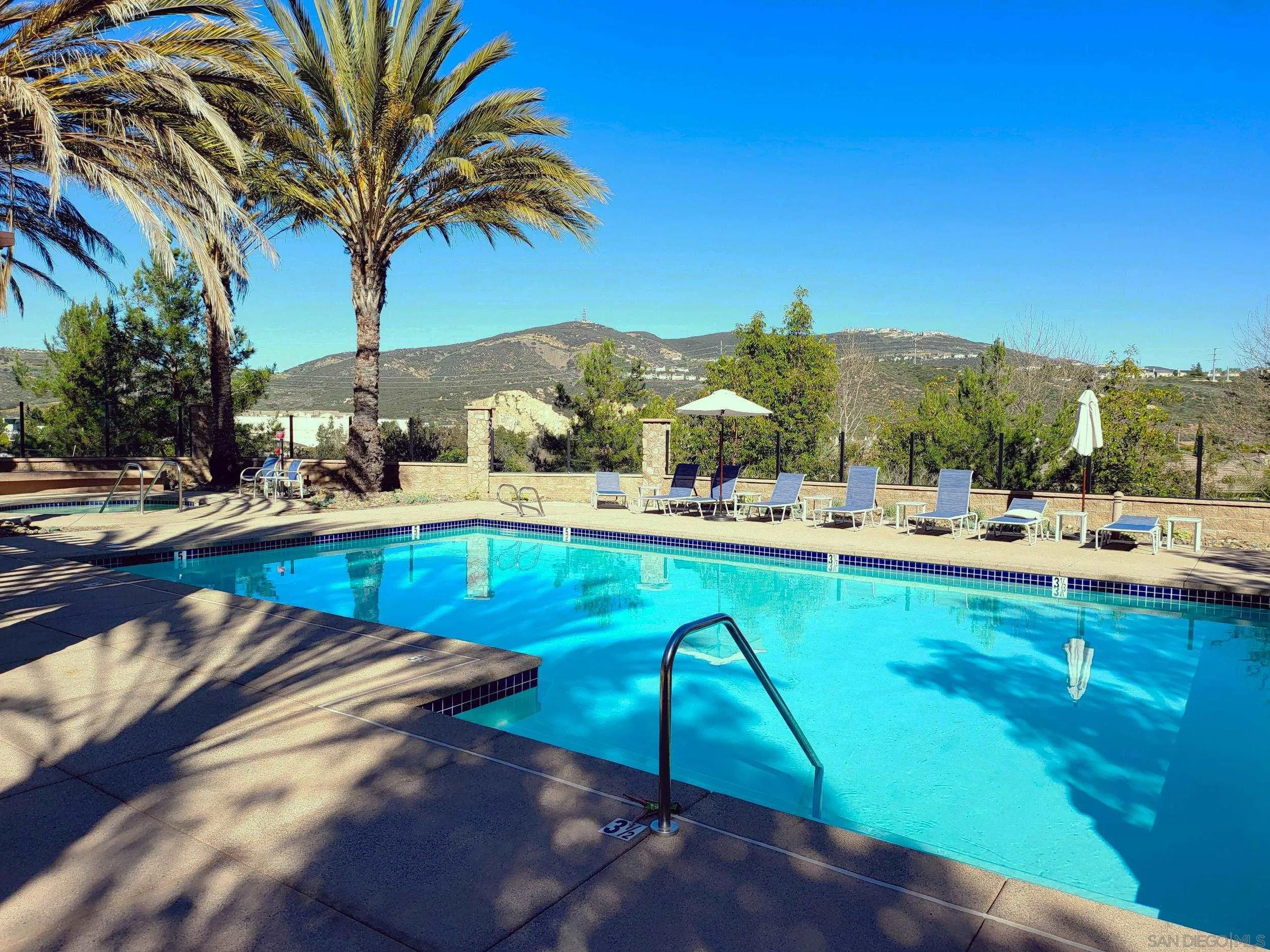2152 Cosmo Way San Marcos, CA 92078 - Photo 23 of 28 a view of swimming pool with a table and chairs