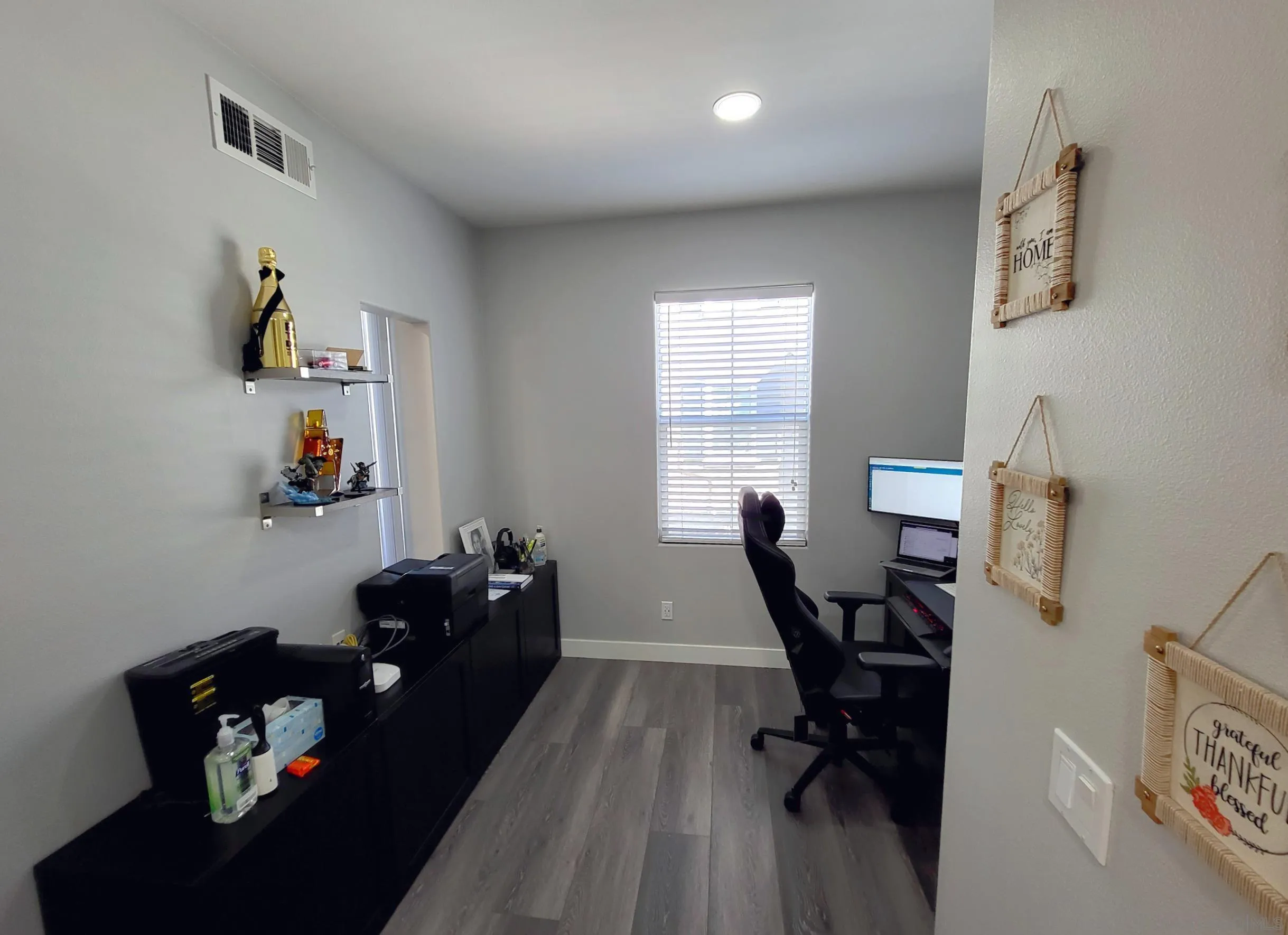 2152 Cosmo Way San Marcos, CA 92078 - Photo 6 of 28 a view of a workspace with furniture and a window