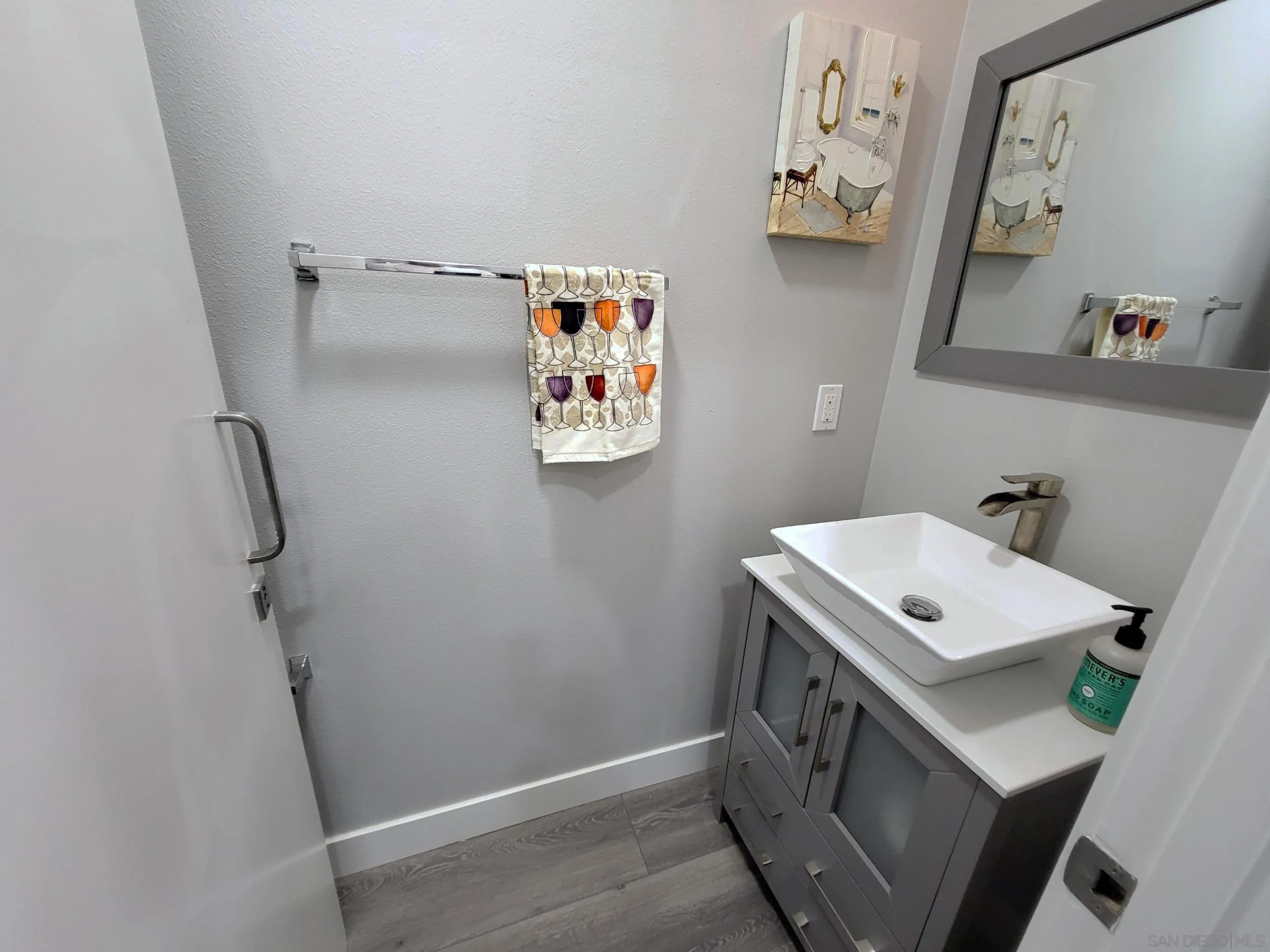 2152 Cosmo Way San Marcos, CA 92078 - Photo 7 of 28 a bathroom with a sink mirror vanity and toilet