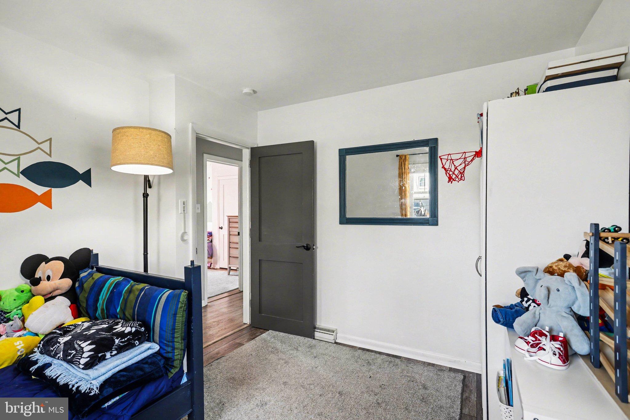 2848 Kissel Hill Road Lancaster, PA 17601 - Photo 14 of 36 a bedroom with a bed and a chandelier