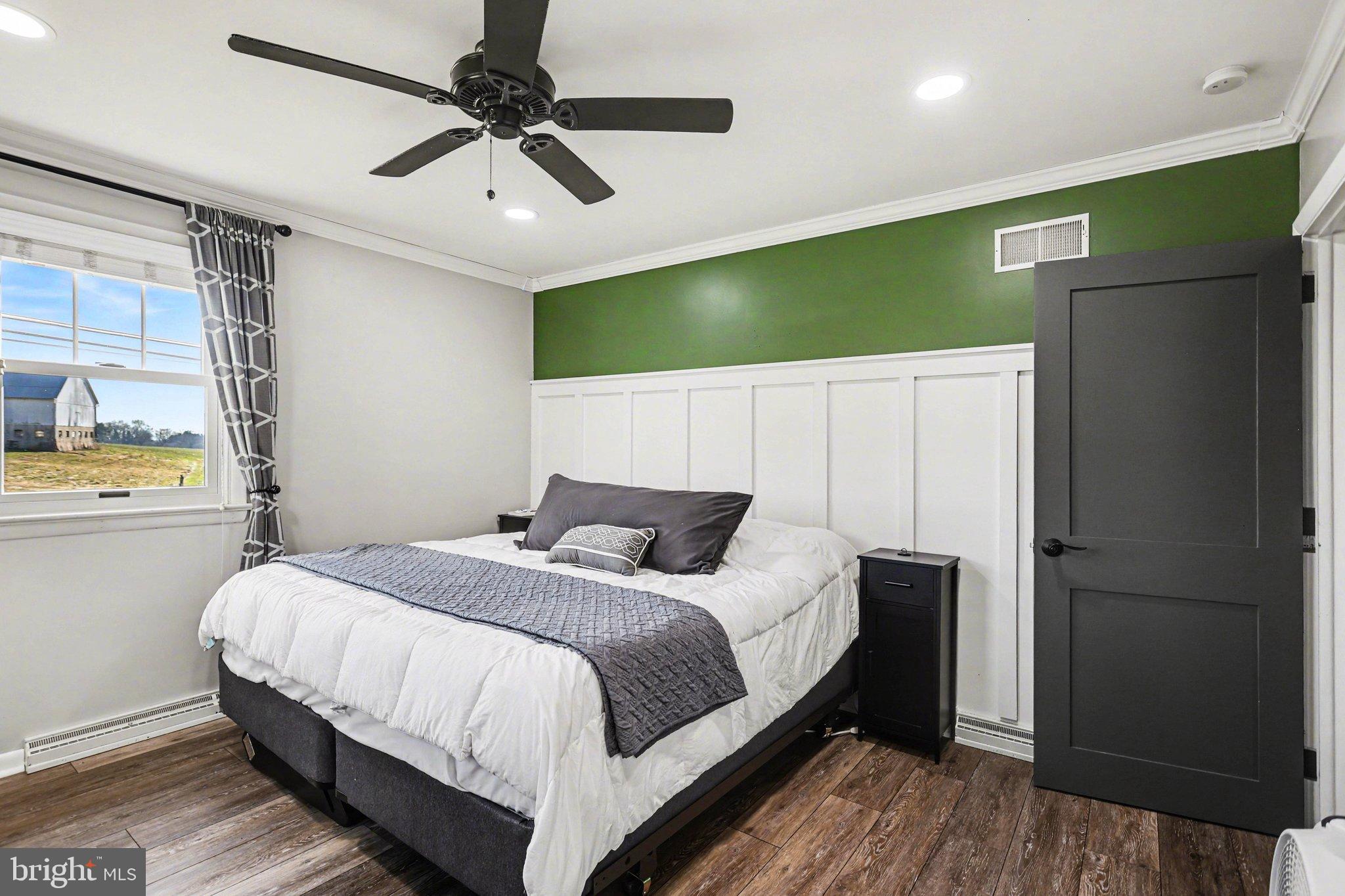 2848 Kissel Hill Road Lancaster, PA 17601 - Photo 17 of 36 a bedroom with a bed and a chandelier