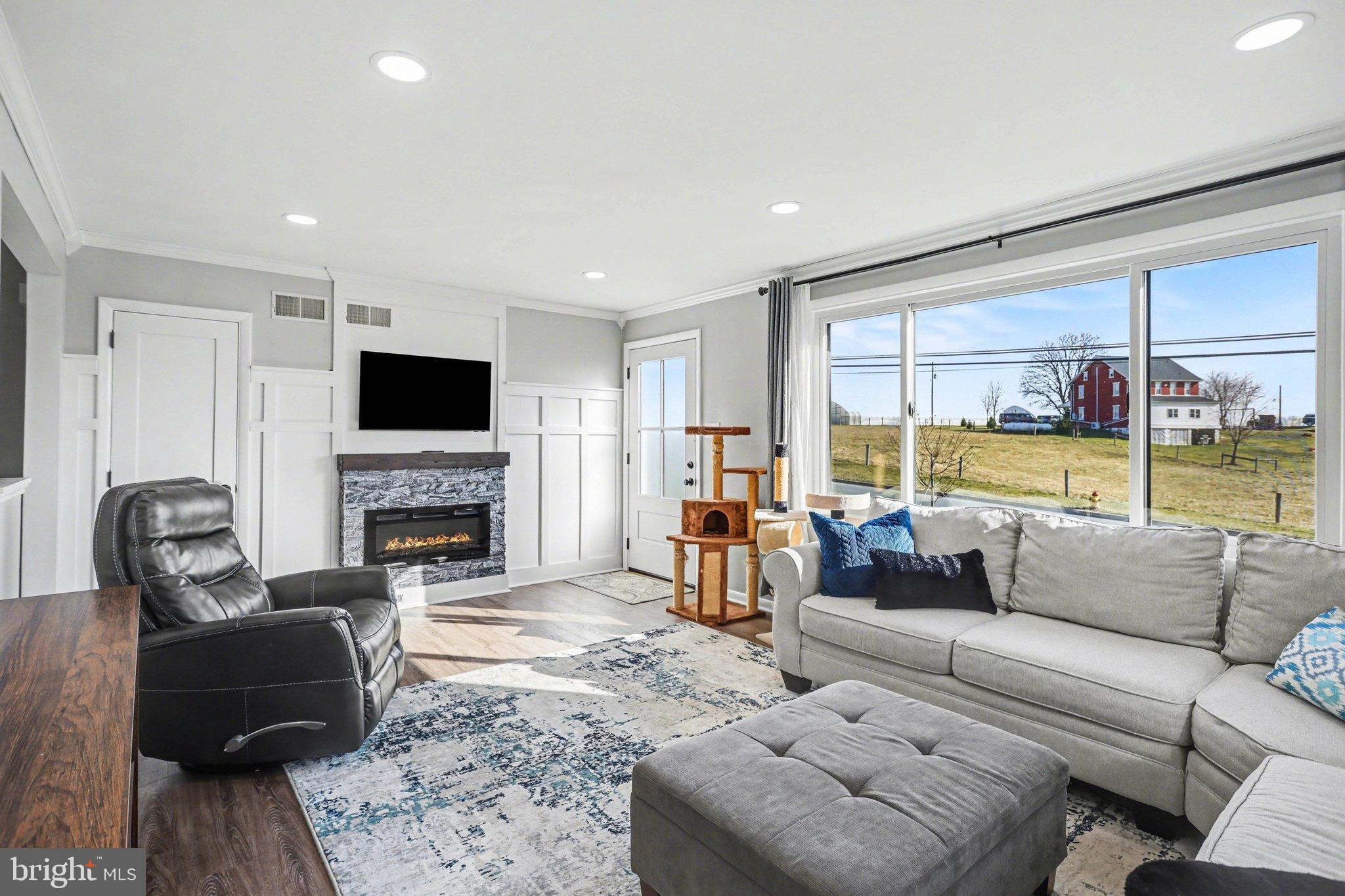 2848 Kissel Hill Road Lancaster, PA 17601 - Photo 21 of 36 a living room with furniture fireplace and a flat screen tv