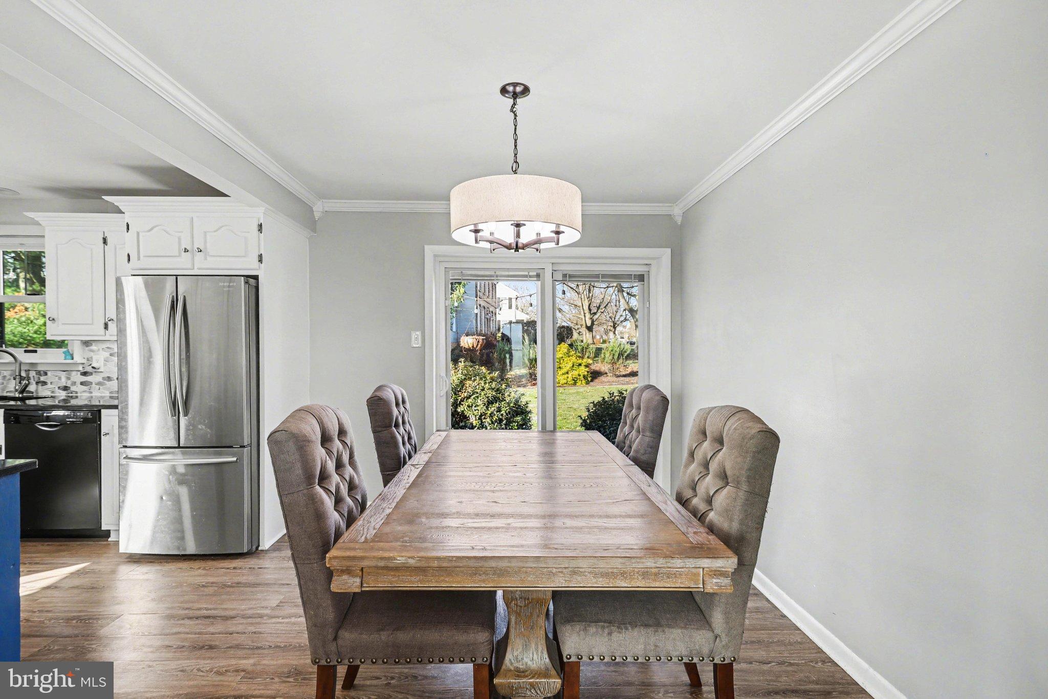 2848 Kissel Hill Road Lancaster, PA 17601 - Photo 22 of 36 a dining room with furniture a chandelier and wooden floor