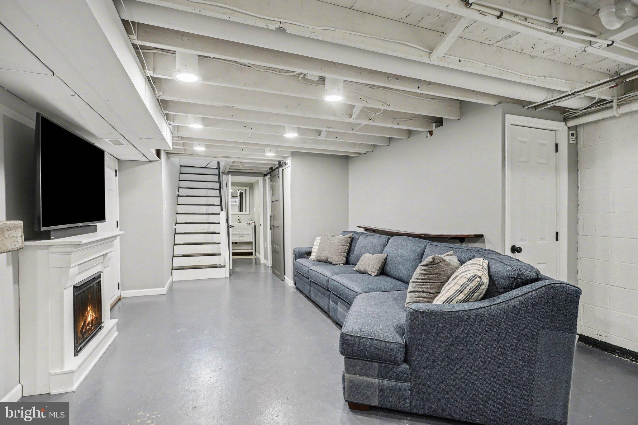 2848 Kissel Hill Road Lancaster, PA 17601 - Photo 24 of 36 a living room with furniture fireplace and flat screen tv