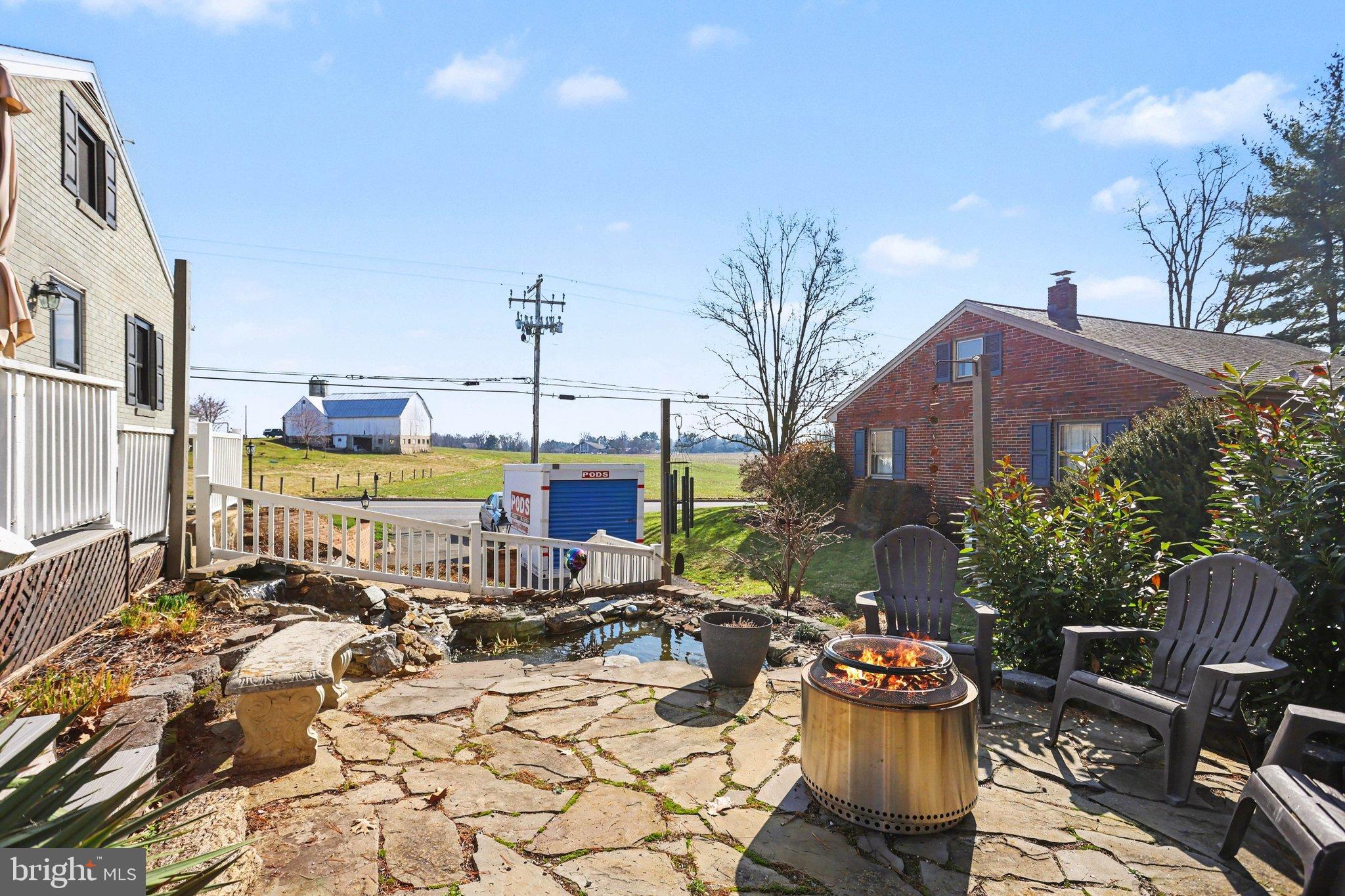 2848 Kissel Hill Road Lancaster, PA 17601 - Photo 34 of 36 a view of a patio with table and chairs potted plants and large tree