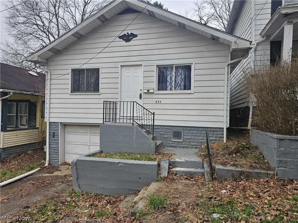 633 Riley Avenue East Liverpool, OH 43920 - Photo 1 of 21 View of front of house with an attached garage