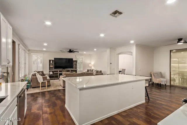 a view of a living room kitchen and a sink