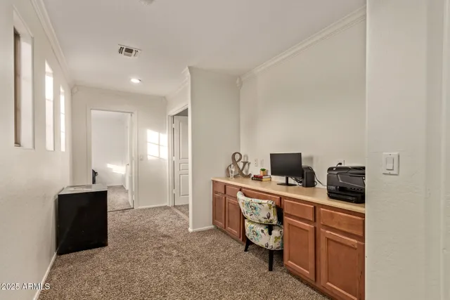 a view of a workspace with furniture