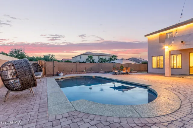 a view of a swimming pool with lounge chair