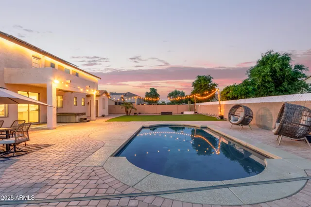 a view of a swimming pool with a patio