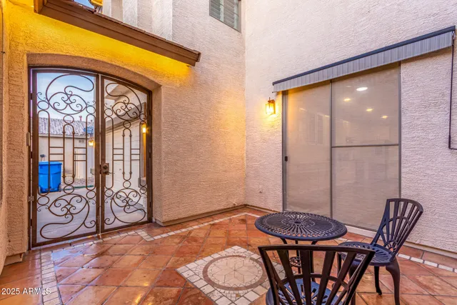 a view of a dining room with furniture and a window
