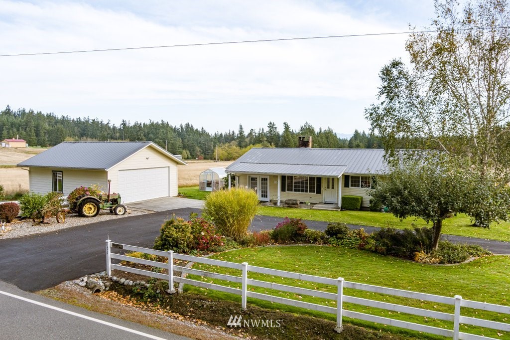 854 Devries Road Oak Harbor, WA 98277 - Photo 3 of 40 a front view of a house with a yard
