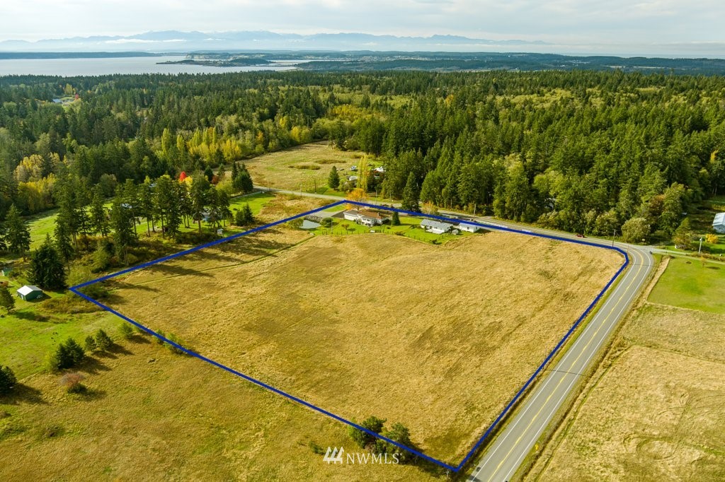 854 Devries Road Oak Harbor, WA 98277 - Photo 4 of 40 a view of a swimming pool and an outdoor seating