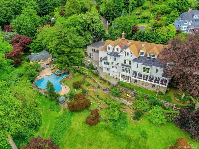 an aerial view of a house with a garden