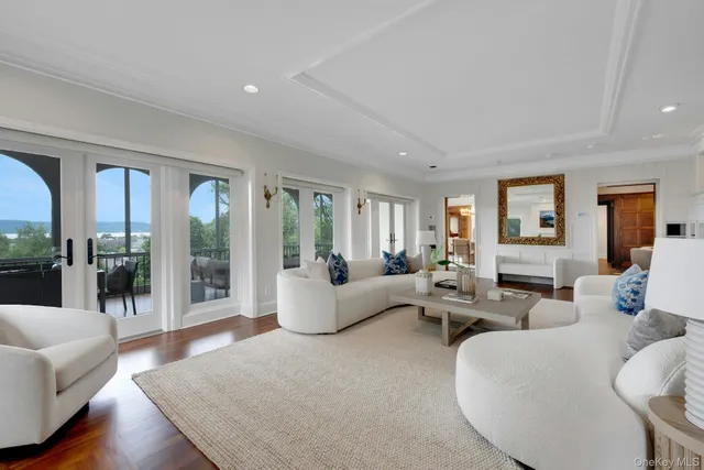 a balcony view with a couch and large windows