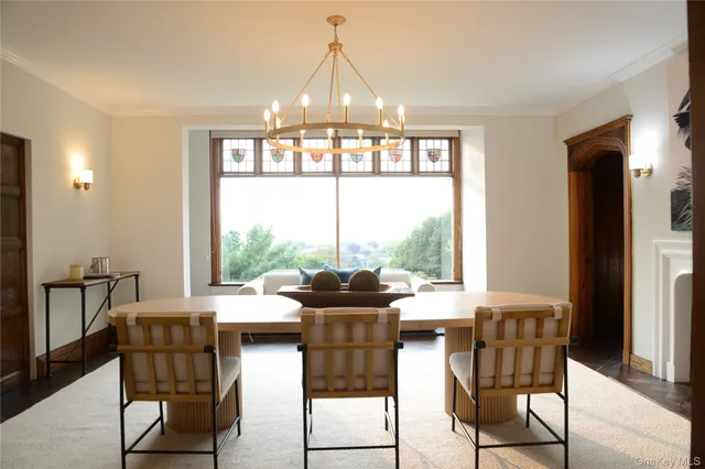 a kitchen with a stove a sink dishwasher a kitchen island with wooden cabinets and floor