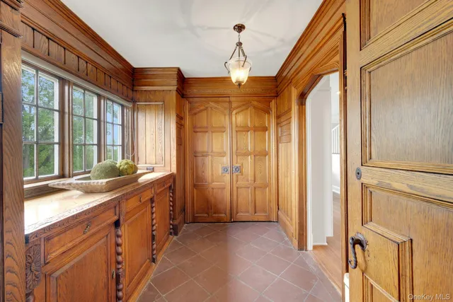 a bedroom with a large bed and a large window