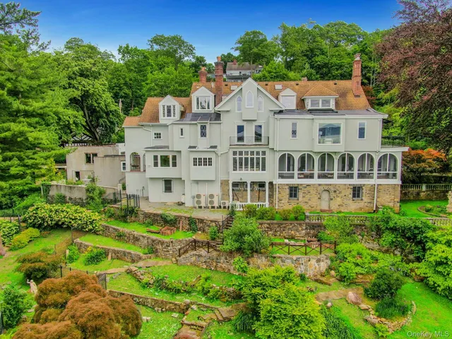 a aerial view of a house with a yard