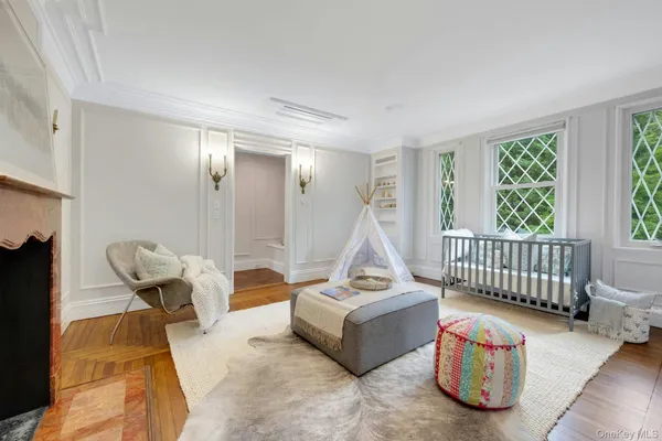 a view of an entryway with wooden floor