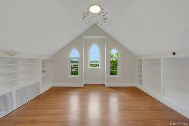 an aerial view of a house with swimming pool and garden view