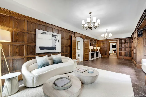 a view of a hallway with dining area
