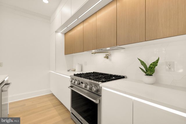 a kitchen with a stove and a sink