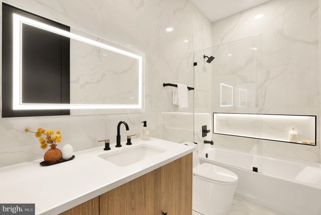 a bedroom with a bed and a chair