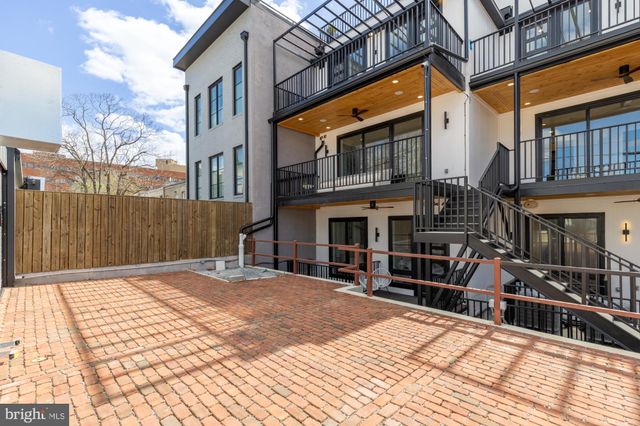 a view of a street with a building in the background